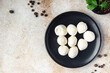 © Alesia Berlezova - mozzarella small balls cow's milk or buffalo, goat healthy meal food snack on the table copy space food background rustic top view