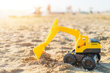 Toy Excavator On The Beach With Copy Space