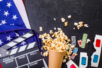 Movie clapper board USA flag, 3d movie cinema glasses and popcorn.  Cinema industry, entertainment