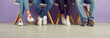 © Studio Romantic - Group of young people waiting in line. College students, classmates and friends in jeans and sneakers sitting in a row. Banner header background. Cropped shot, low section, legs and feet on the floor