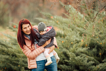 Wall Mural - Mother and daughter having fun in the park