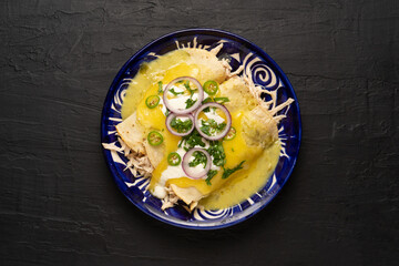 Wall Mural - Mexican green enchiladas with chicken and melted cheese