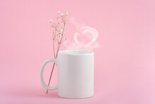 Mockup White Coffe Cup Or Mug On A Pink Background. Hot Drink Steam In The Form Of Heart
