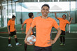 © Odua Images - Cheerful male futsal player poses standing with thumbs up