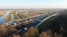 Highway Photographed From The Air With A Drone. Along The Dutch City Of Zaandam In The Netherlands With A Polder Landscape In The Background. Choose Destination And Arrive At Your Goal.