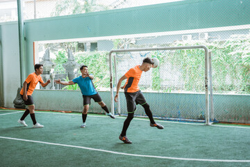 Wall Mural - a player heads the ball when scoring a goal