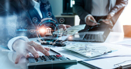 Leinwandbilder - Businesswoman using calculator calculate for finance with laptop,  Online banking and payment, Finance and banking networking with icon customer connection, Digital marketing, Business of technology
