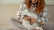 © Михаил Решетников - Red-haired Caucasian woman hugging with a dog and a cat.