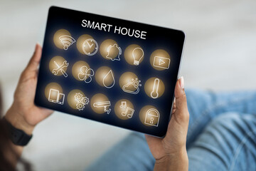 Poster - Smart house panel in black woman hands, closeup