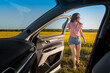 woman stop to enjoy sunset at road trip