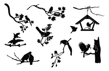 set of silhouettes of birds sitting on tree branches. collection of black outline of a flock of spri