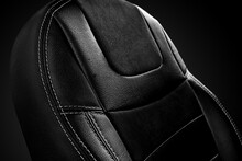 Closeup Of Ergonomic Black Backrest Of Passenger Car Seat On Dark Background