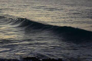 Wall Mural - waves at sunset in the Canary Island contemplating its colors and horizon