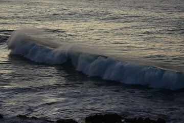 Wall Mural - waves at sunset in the Canary Island contemplating its colors and horizon