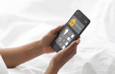 Poster - Cropped of black woman using smart home system