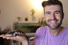 Cute Man And His Exotic Blue-tongued Lizard