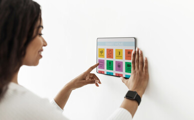 Poster - Black housewife enjoying her smart home automatic system