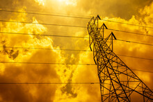 High Voltage Tower Electric Pole And Wire With Warm Light Tone.