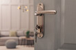 © New Africa - Closeup view of open door with key in room