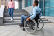 Black disabled guy suffering from lack of wheelchair friendly facilities, cannot enter building without ramp