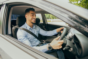 Wall Mural - Positive middle-eastern guy going to office, driving car