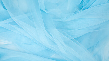 Beautiful layers of delicate light blue fabric background.