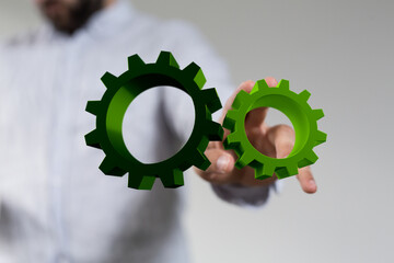 Poster - Mechanism, green metallic gears and cogs at work on brown background. Industrial machinery. 3D