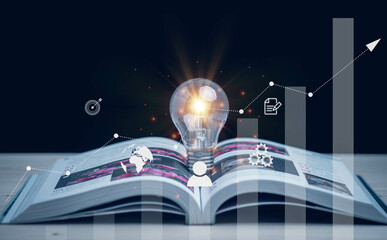 Glowing light bulbs on books and stock graphs. Reading inspired concept. concept innovation Educational knowledge and business education concepts.