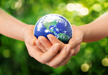 Care And Protect Our World In Human Hands Concept, Hands Holding Planet Earth On Nature Green Background, Elements Of This Image Furnished By NASA