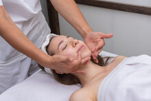 Young Woman Lying On A Stretcher In An Aesthetic Center Performing Beauty Treatment And Facial Aesthetics With Dermapen And Dermaplaning Techniques