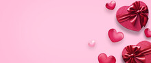 Valentine's Day Decorations With Heart Shaped Gift Boxes And Small Hearts On Pink Background. Top View.