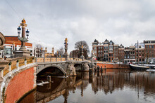 View At The Blauwbrug, Or Blue Bridge In English In The Historic City Center Of Amsterdam