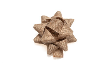 Wall Mural - burlap jute gift bow isolated cutout on white background, design element, present decoration.