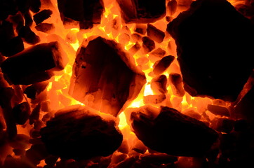 Poster - A bright contrasting background consists of burning anthracite coal of different fractions.