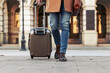 © ivanko80 - Close up of man carrying suitcase