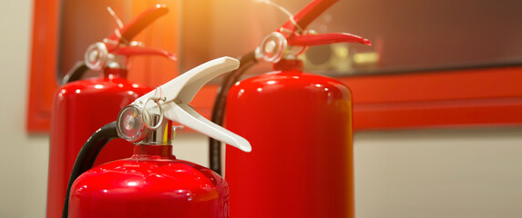 Fire extinguisher, Close-up red fire extinguishers tank in the building concepts of protection and prevent for emergency and safety rescue and fire training.