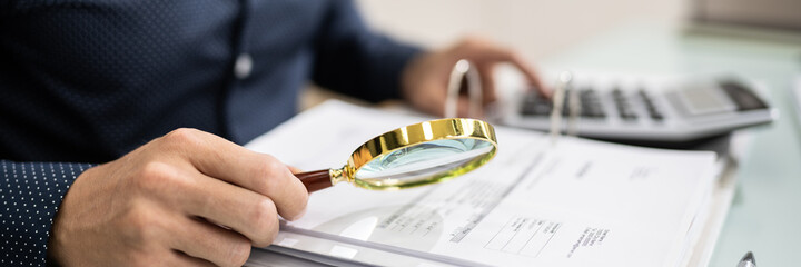 Canvas Print - Auditor Using Magnifying Glass For Audit