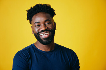 Portrait Of Cheerful Bearded Man studio portrait closeup yellow background