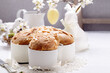 Colomba - italian festive easter dove cake on white rustic background. Selective focus.