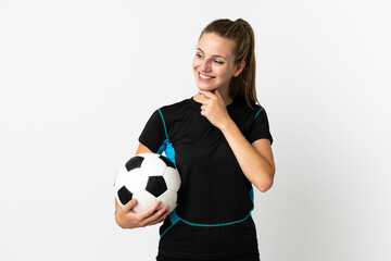 Wall Mural - Young football player woman isolated on white background looking to the side and smiling