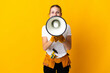 © luismolinero - Young electrician woman isolated on yellow background shouting through a megaphone
