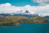 Fototapeta Tęcza - Lake in mountainous area with snowy mountain tops in the background in Chilean Patagonia
