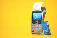 POS Point Of Sale Terminal For Credit Card Payment On Yellow Background.