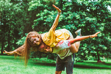 Canvas Print - young pretty couple having fun at holi fest