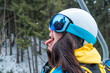 woman skier stick out tongue catching snow
