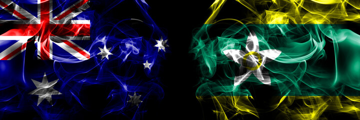 Flags of Australia, Australian vs Japan, Japanese, Ehime Prefecture. Smoke flag placed side by side on black background