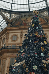 decorated christmas tree in galleria vittorio emanuele, milan, italy