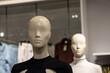 front image of shiny white female mannequin doll with a male mannequin figure in the back, front image of a display dummy figures
