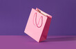© Darya Lavinskaya - Pink flying paper shopping bag on purple background. Shopping sale delivery concept