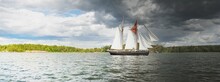 An Elegant Two-masted Gaff Schooner (tall Ship, Sailboat) Sailing In Mälaren Lake, Sweden. Travel, History, Transportation, Sailing, Sport, Cruise, Regatta, Nautical Vessel. Panoramic View